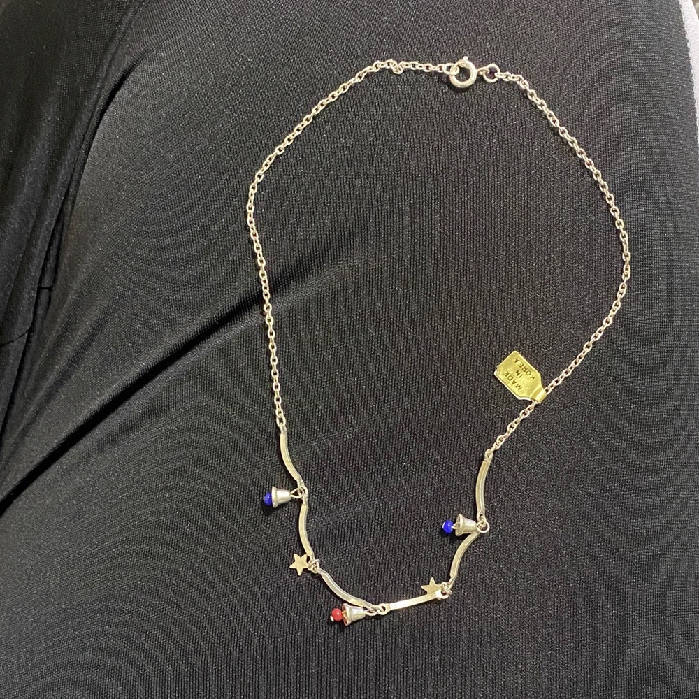 Elegant Silver Necklace with Red and Blue Accents